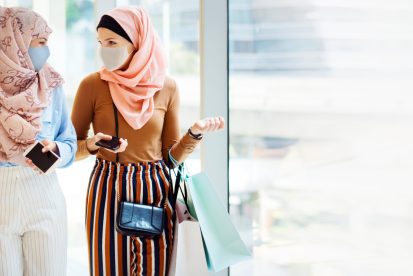 Muslim girls in face mask shopping at the mall in new normal
